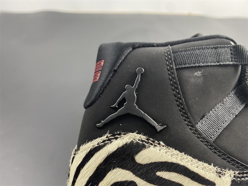 Air Jordan 11 “Animal Instinct” Black / Red / Sail / White AR0715-010